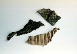 Image of fragments of textile found in the Lawshall cache. Copyright Paula and Barry Harber.