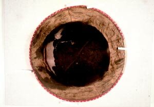 A medieval hat (14th century) found concealed in the buttresses of the church tower at Little Sampford, Essex in 1908. It was brought to the Textile Conservation Centre to be conserved in 1979/80 by by Saffron Walden Museum. It is now on display at Saffron Walden Museum, Essex with a replica.